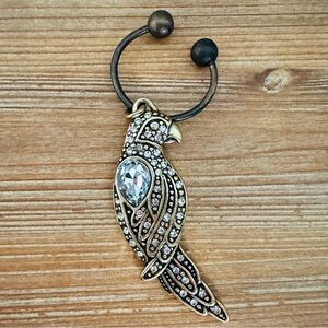 Beautifully detailed brass Chicos 2010 key ring. Crystal embellished.